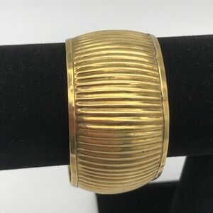 Brass cuff bracelet. 2.5” diameter. Band is 1.5” with 1” space.